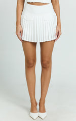 Erica Mini Skirt - Yoke Waist Pocket Detail Pleated Skirt in Off White