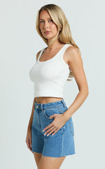 Jacqui Shorts - Mid Rise Frayed Hem Denim Shorts in Light Mid Blue